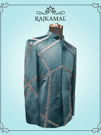 Another view of the teal velvet jacket, showing the full pattern of the sequin work.