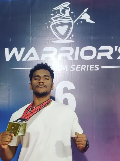 Another angle of our fighter with his two gold medals from WDS6. We train for dominance in all aspects of mixed martial arts.