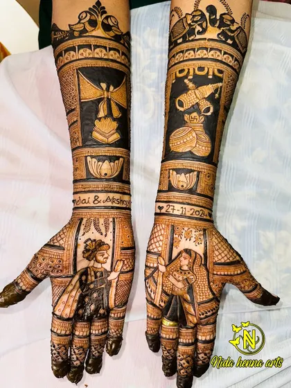 This full-arm design features bride and groom portraits, the wedding date, and symbols representing the couple's story, like the agni kund (holy fire) and shehnai.