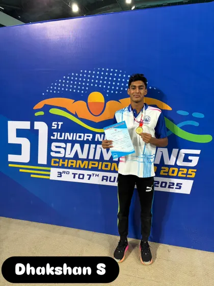Dhakshan S with his gold medal after setting a new meet record.