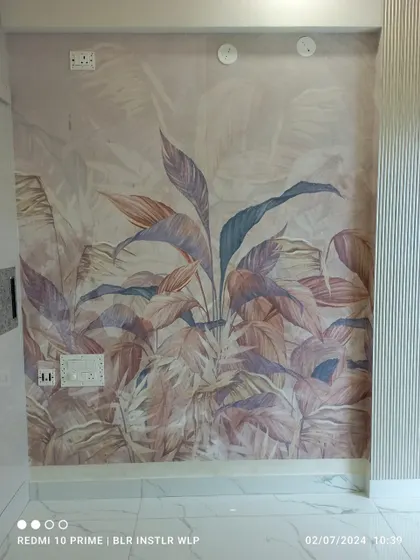 A soft, pastel-toned tropical leaf mural, perfect for a serene and stylish accent wall.