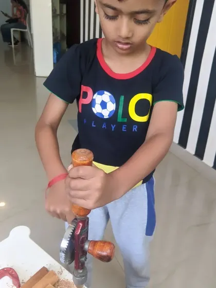 This little guy is all business as he works the hand drill. We love seeing their intense focus.