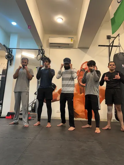 Our members standing together in front of the iconic Nate Diaz mural. We are inspired by the warriors of the sport and bring that spirit to our own training.