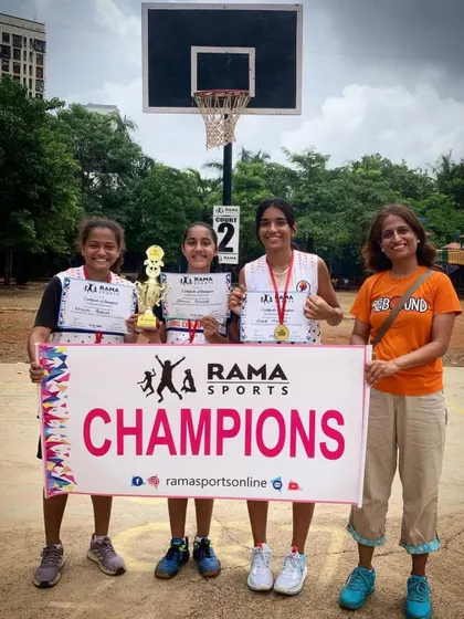 Another group of champions holding their trophy and certificates high. We help teams celebrate their success on the court.