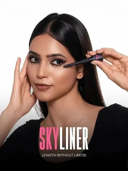 A clean and direct model shot demonstrating the application of the "Skyliner" eyeliner. This type of image is highly effective for showing product use and precision on e-commerce sites and in tutorials.