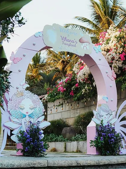 Welcome to Vihaana's Fairyland! This entrance arch, with its soft pastel colors and intricate butterfly-winged fairy cutouts, sets a dreamy and inviting tone for a magical first birthday celebration.