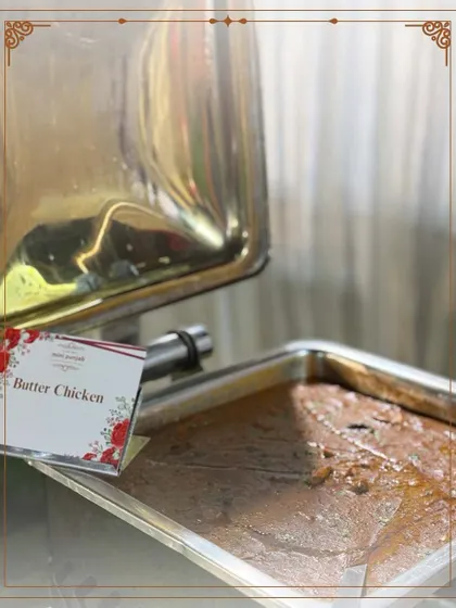 Our signature Butter Chicken is a timeless classic. This close-up shows the rich, velvety texture of the gravy, a result of slow cooking and the finest ingredients.