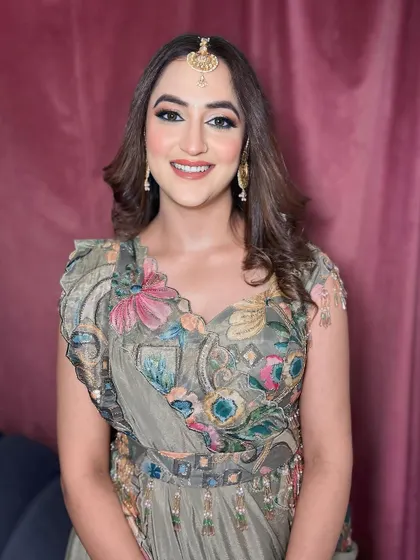 Her smile shows how happy and confident she feels in her party makeup.