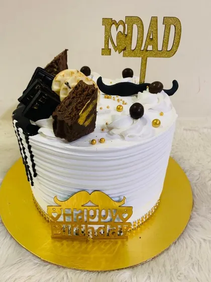 A special cake for Dad, topped with a mustache, brownies, and a "I love Dad" topper.
