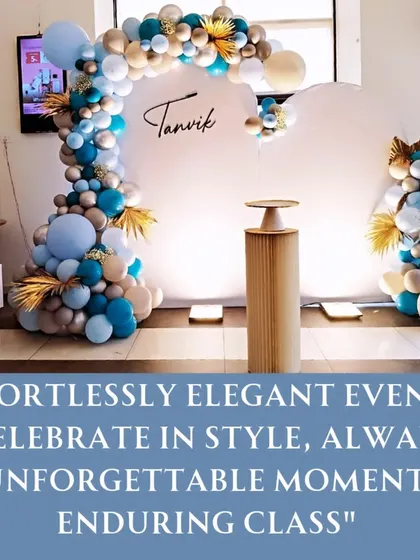 A promotional image showcasing our effortlessly elegant event style. This setup features a modern blue, white, and gold balloon arch, perfect for naming ceremonies or first birthdays.