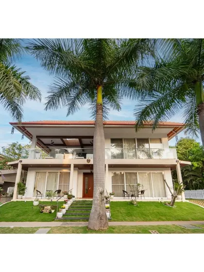 Capturing the essence of elegance and tranquility, this stunning villa with its multiple balconies is nestled amidst lush greenery, setting the stage for a life of luxury and comfort.