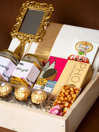 Another view inside the 'Pichi Poo' hamper, showing the arrangement of snacks, sweets, and cultural items, ready to bring the taste of Onam to any home.