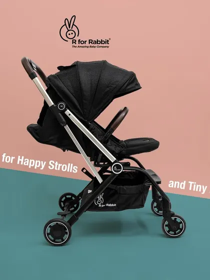 A side-profile shot of the R for Rabbit stroller, showcasing its sleek design and features against a modern, two-tone background.