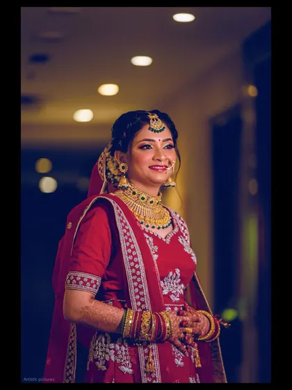 My stunning North Indian bride looks absolutely radiant for her Pheras. The classic red lehenga, gold jewellery, and a bright, happy smile make for a picture-perfect wedding moment.