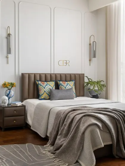 The guest bedroom at Casa Zen was designed to feel like a warm embrace. Classic wall paneling, a channel-tufted headboard, and layered textiles in neutral tones create a sophisticated and welcoming retreat for visitors.