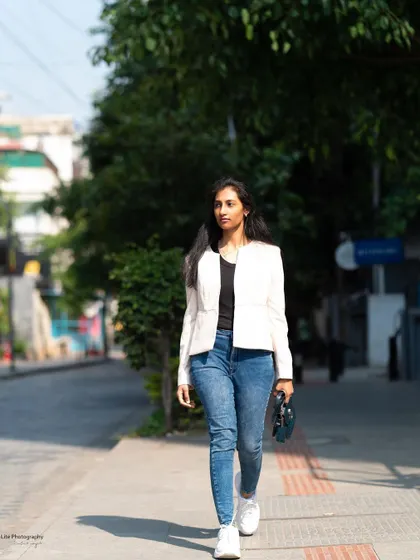 A casual walking shot on a Bangalore street. This captures a real-life moment, perfect for lifestyle branding or a natural portfolio.