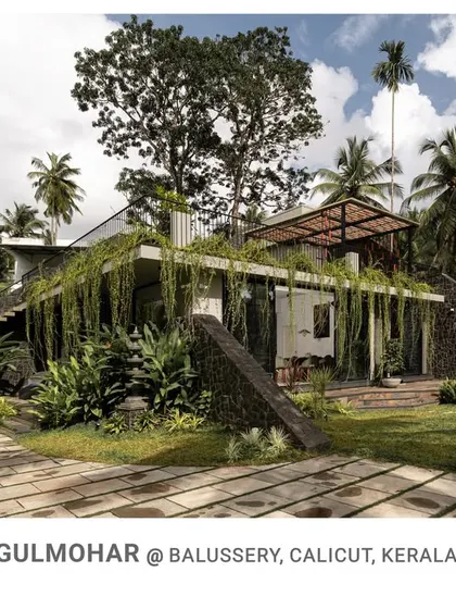 Welcome to Gulmohar, a home I designed to be a living part of its natural surroundings. With curtain creepers draping the facade and stone-clad walls, this residence blurs the line between architecture and landscape, creating a tranquil, sustainable living experience.
