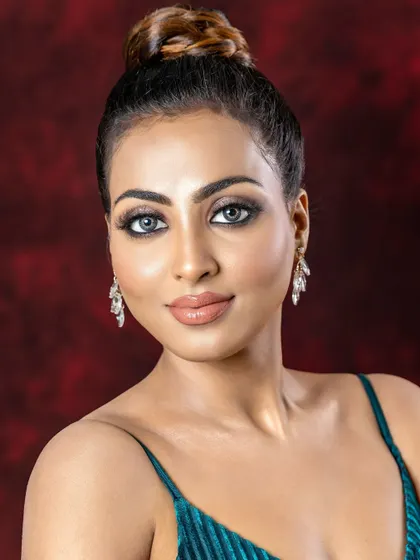 A close-up of the dramatic eye makeup and perfectly defined features.