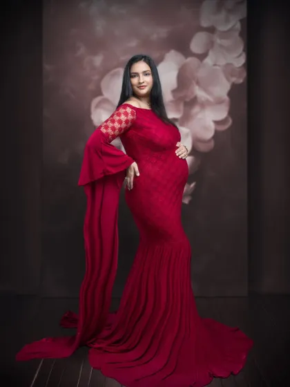Every frame tells a story, and this one speaks of elegance, grace, and timeless beauty in a stunning red gown.