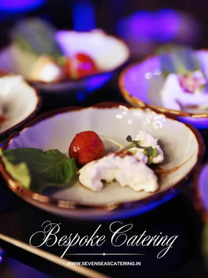 Bespoke catering means every detail is considered. This small plate features a simple yet elegant composition of fresh cheese, ripe tomato, and basil, proving that luxury can be found in the finest ingredients.