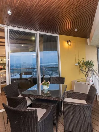 Another view of the spacious balcony, offering a stunning city view and a perfect outdoor retreat.