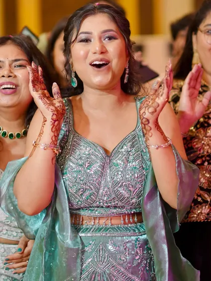 A moment of pure joy and excitement, her hands up in celebration.