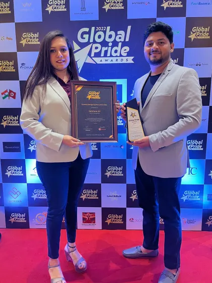 Our project manager and interior designer proudly holding our award. A successful turnkey project requires seamless collaboration between the design and execution teams, and we are proud of the talented people who make it happen.
