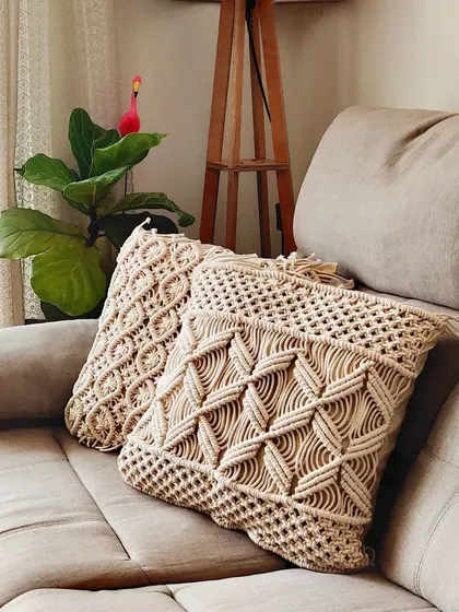 Another view of the macrame cushion covers, which bring a cozy, bohemian feel to this sofa.