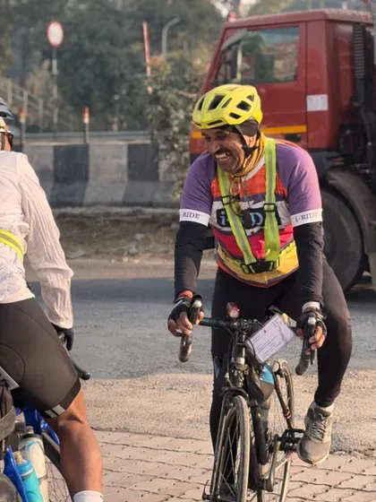 A candid moment of laughter and conversation between two riders on the road. It's these small moments that keep the spirits high.