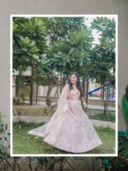 A beautiful full-length portrait of the bride-to-be, framed to look like a classic photograph. Her twirling lehenga adds a sense of movement and joy.