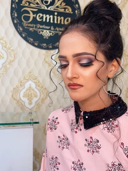 Another angle of the messy bun and smokey eye look.