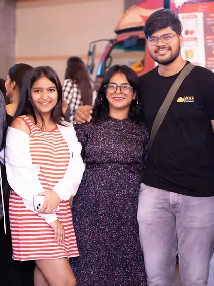 A group of friends enjoying the food and music at the open-air venue.