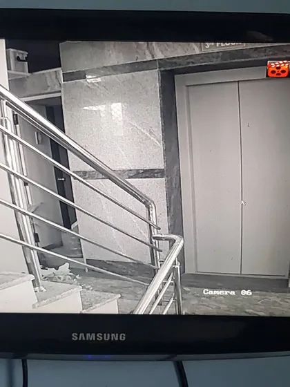 An indoor camera focused on an elevator door and landing, a critical security checkpoint.