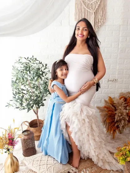 A beautiful moment between a mother and her daughter as they wait for the new baby. Maternity sessions can be a wonderful way to include older siblings in the celebration.