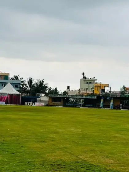 A view of the tournament setup from the outfield, showing the proximity of the player tents to the ground.