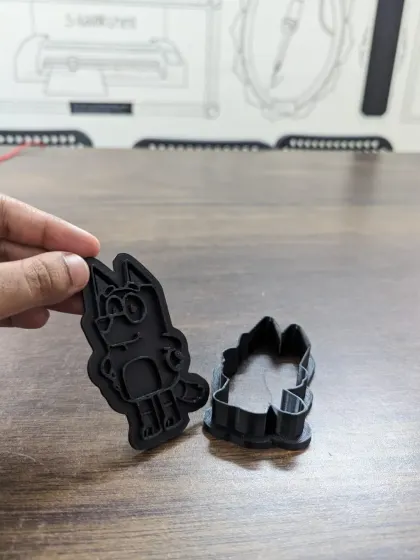A custom 'Bluey' character cookie cutter, hot off the 3D printer. This is a great example of how you can create personalized items for parties or as gifts.