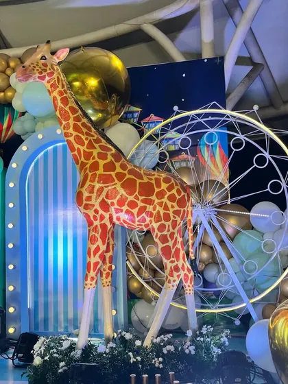 Another shot of the impressive giraffe and Ferris wheel prop, showcasing the scale and detail.