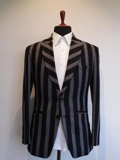 Pause for a classic break with our two-button jackets in flannel wool. This striped version offers a bold, graphic statement.