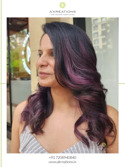 Purple passion meets dark brown elegance. We added these stunning purple highlights to give our client a bold and beautiful new look.