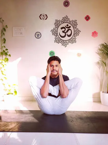 This advanced seated posture, a variation of Garbha Pindasana, requires extreme hip flexibility and core engagement. My one-on-one sessions are designed to help you safely explore and advance your practice, whatever your goals may be.