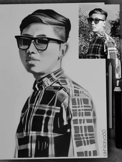 This A4 graphite sketch of a man in a plaid shirt shows how I can handle patterns and textures even in black and white, creating a realistic and stylish portrait.