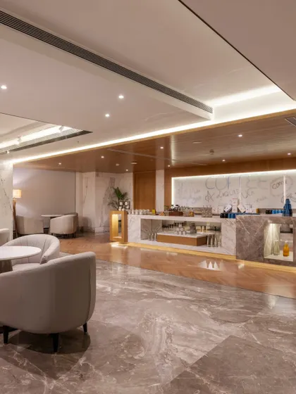 Additional views of the Radisson Resort, Khopoli, showcasing various interior and exterior details, from lobby seating areas and restaurant layouts to guest room configurations and architectural elements.