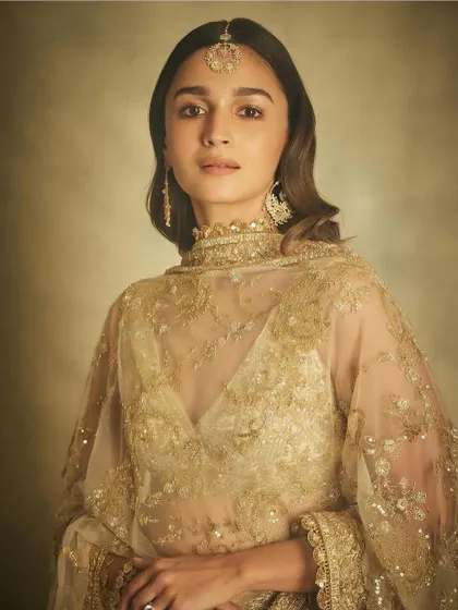 Alia Bhatt wearing my handcrafted earrings and maang tika. The design combines traditional Indian jewelry forms with my signature delicate, lace like gold work.