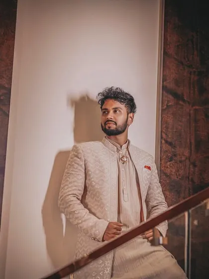 A cool and stylish portrait of the groom, using architectural elements and shadows.