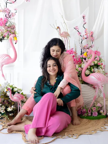 A cozy and happy portrait of a mother and daughter. We want our studio to feel like a second home, where you can relax and enjoy the moment.