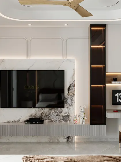 A master bedroom design for Apex D'Rio featuring custom circular wall paneling behind the bed. The opposite wall has a TV unit integrated with a workstation, all in a calming, neutral palette.