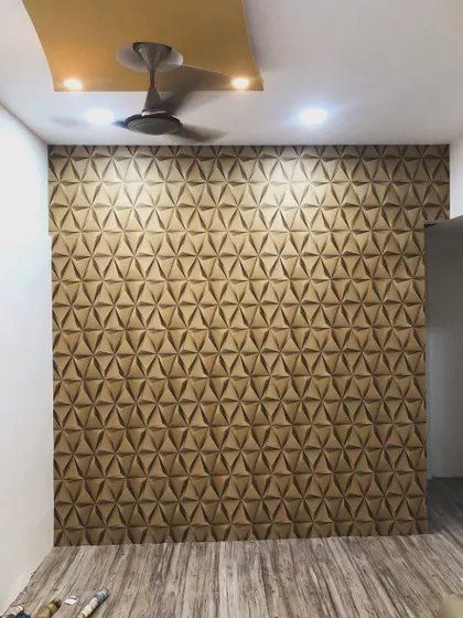 A full accent wall featuring a 3D geometric triangle pattern. This wallpaper adds a modern, architectural feel to the room and plays with light and shadow.