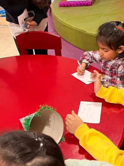 Birthday celebrations at The Reading Room always include a fun craft or activity. Here the kids are busy with a writing game.