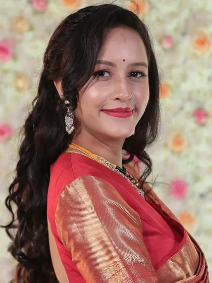 A bright, happy portrait of the bride. Her smile and the classic red lip are the perfect combination for a celebratory occasion.