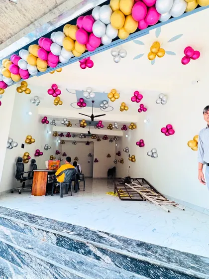 Another view of the office inauguration decor, showing the entrance arch and the interior ceiling balloons.